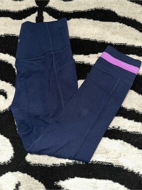 Athleta Salutation Stash 7/8 tight size small navy with pink stripe at leg